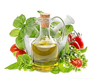 Bottle of olive oil with fresh mediterranean herbs