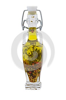 Bottle of olive oil with herbs isolated