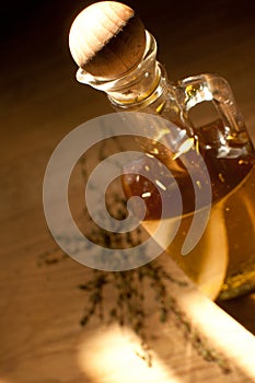 Bottle with olive oil and herbs