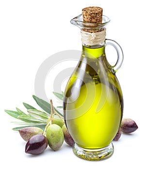 Bottle of olive oil and olive berries on white background.