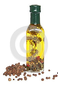 Bottle of olive oil with spices and herbs