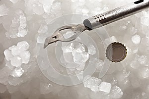 Bottle opener and cap on crushed ice
