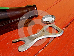 Bottle and opener on the table