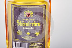 Bottle of original albanian brandy Skenderbeu on gradient background.