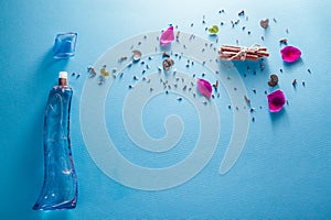 Bottle of perfume with ingredients