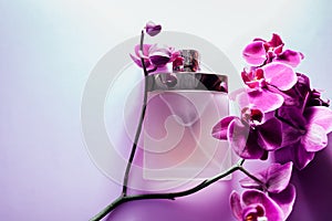 Bottle of perfume with orchid