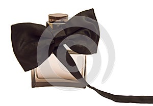 Bottle of perfume with a tuxedo bow