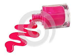 Bottle of pink nail polish with enamel drop photo