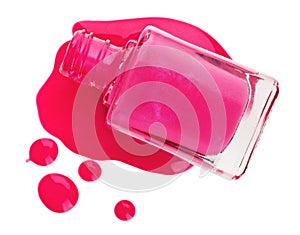 Bottle of pink nail polish with enamel samples