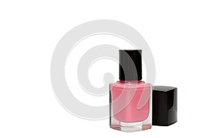 Bottle of pink nail polish isolated on white background
