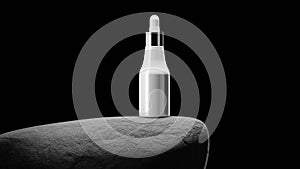 Bottle with pipet on big grey stone