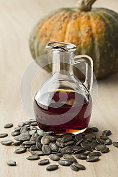 Bottle with pumpkin seed oil and roasted seeds