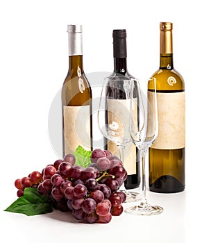 Bottle of red and white wine with grapes