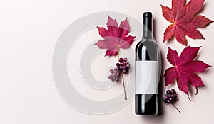 a bottle of red wine and autumn leaves