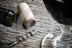 Bottle of Red Wine with Cork, Corkscrew and Glass