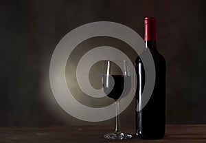 A Bottle Of Red Wine And Filled A Wine Glass