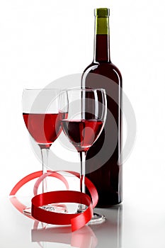 Bottle with red wine and glass