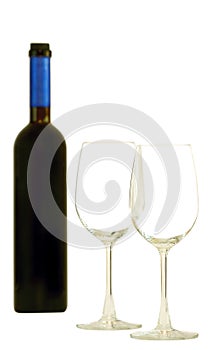 A bottle of red wine and glasses