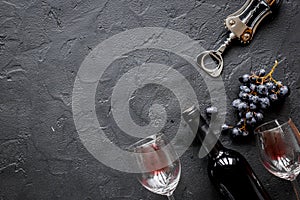 Bottle of red wine with glasses on texture background top view mock-up