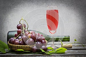 Bottle of red wine and grape