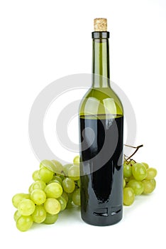 Bottle with red wine and green