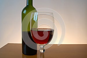 Bottle of red wine with wineglass