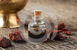A bottle of sangre de drago oil and resin photo