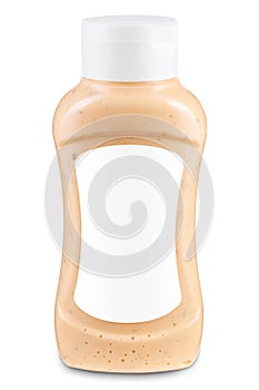 Bottle of sauce with blank white label isolated on white background. Mock-up for product design. Dijons sauce, coleslaw dressings