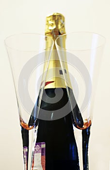 Bottle of shampagne and a pair glasses isolated on the white background