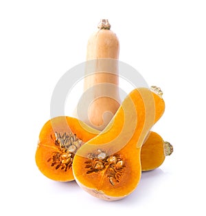 Bottle shaped butternut pumpkin and a cut one on a white background