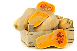 Bottle shaped butternut pumpkins and two halves photo