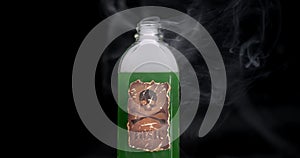 Bottle with skull and crossbones warning label, filled with toxic green liquid bubbling up and smoking. Concept for suicide by