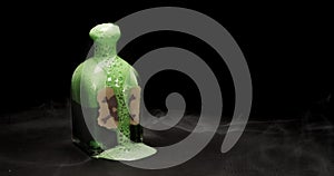 Bottle with skull and crossbones warning label, filled with toxic green liquid bubbling up and smoking. Concept for suicide by