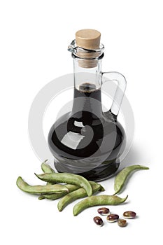 Bottle with soy sauce and fresh soybeans