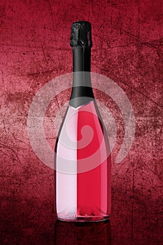 Bottle of sparkling wine on colorful pink background