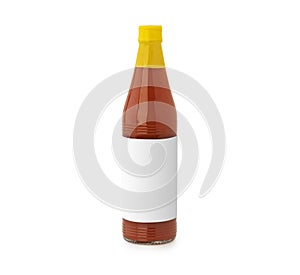 Bottle of spicy, red hot sauce with blank label isolated on white background