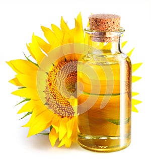 Bottle of sunflower oil with flower.