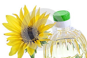 Bottle of sunflower oil with flower isolated on white