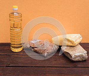 A bottle of sunflower oil and various cereals in the kitchen