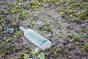 Bottle throw away in a field