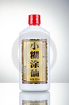 Bottle of typical strong chinese liquer isolated on gradient background.