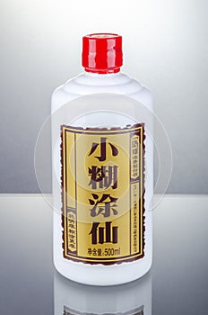 Bottle of typical strong chinese liquer isolated on gradient background.