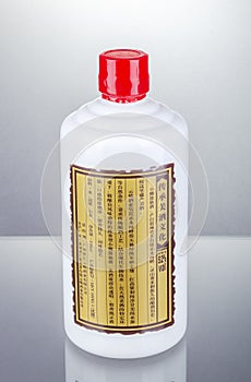 Bottle of typical strong chinese liquer isolated on gradient background.