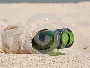 Bottle from under beer in paper