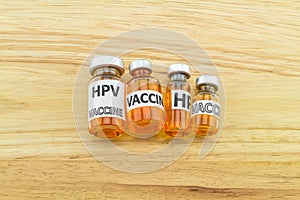 Bottle vaccine of Human papillomavirus (HPV) vaccine on wooden b