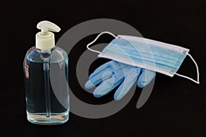 Bottle of virus disinfectant soap with mask and glove