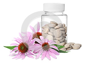 Bottle with vitamin pills and beautiful echinacea flowers on white background