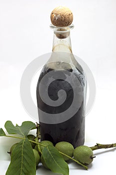 Bottle of walnut liqueur with nuts