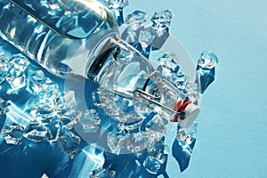 Bottle of water with ice on a blue