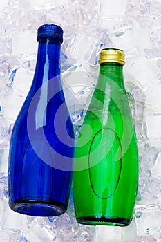 Bottle of water on ice cubes